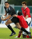 New Zealand Maori's Hosea Gear stretches the NZ Barbarians defence