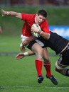 New Zealand Barbarians' Colin Slade is tackled