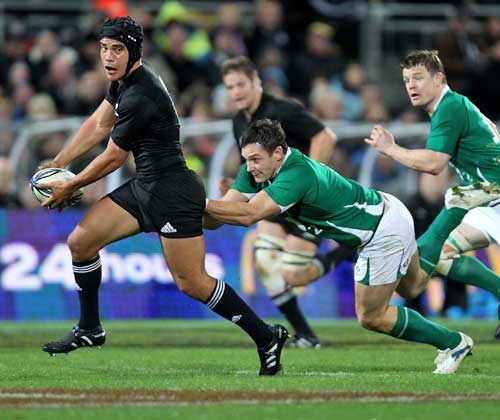 New Zealand's Benson Stanley beats the Ireland defence