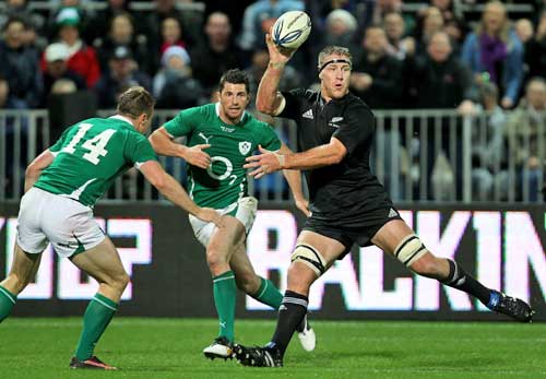 New Zealand's Brad Thorn off loads the ball