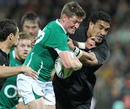 Ireland's Ronan O'Gara is shackled by the New Zealand defence