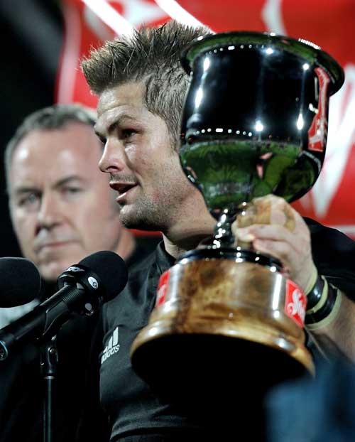 New Zealand captain Richie McCaw poses with the silverware