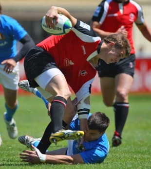 Canada's Matt Evans is tackled by the Italy defence, Italy v Canada, IRB Junior World Championship, Cardiff Arms Park, Cardiff, Wales, June 22, 2008