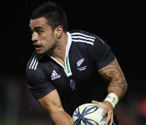 New Zealand Maori skipper Liam Messam checks for support