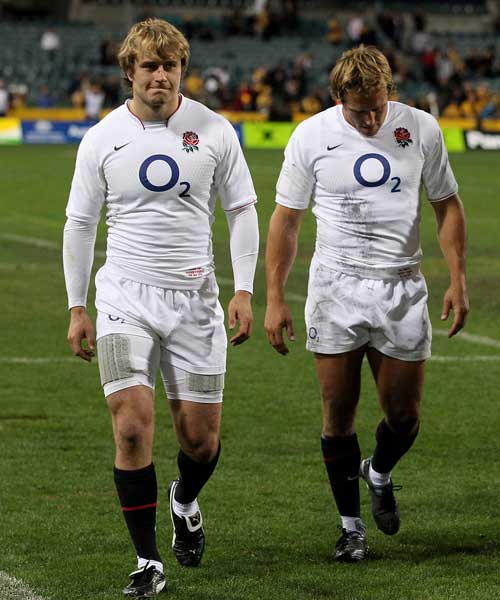 England's Mathew Tait and Jonny Wilkinson trudge from the field