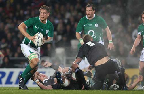 Ireland No.8 Chris Henry looks for support