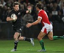New Zealand's Cory Janes fends off Wales' Lee Byrne