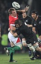 New Zealand's Richie McCaw tackles Wales' Matthew Rees