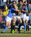 South Africa's Bakkies Botha is shackled by the Italy defence