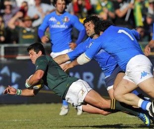 South Africa's Morne Steyn is felled by the Italy defence, South Africa v Italy, Puma Stadium, Witbank, South Africa, June 19, 2010