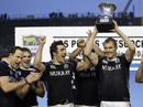 Scotland's Alastair Kellock lifts the silverware following victory over Argentina