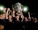 New Zealand players celebrate with the Bledisloe Cup