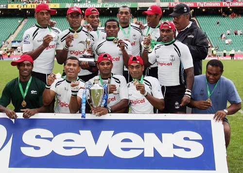Fiji's Sevens side celebrates with the IRB Sevens trophy