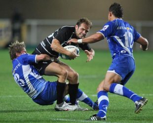 Greg Barden of Bristol is tackled by Ollie Smith during the European Challenge Cup match between Montpellier and Bristol at Stade Yves du Manoir in Montpellier, France on October 10, 2008.