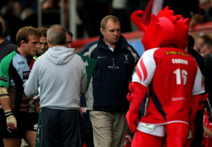 Harlequins head coach Dean Richards leaves the field after the Heineken Cup Round One match between Scarlets and Harlequins