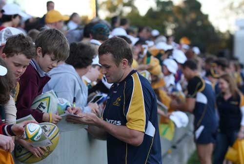 Australia centre Matt Giteau signs autographs for fans