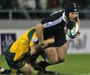 New Zealand's Tyler Bleyendaal stretches the Australian defence