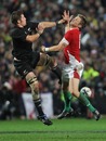 New Zealand's Richie McCaw and Wales' Dan Biggar compete for the ball