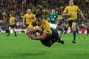 Australia scrum-half Luke Burgess dives in to score his side's first try