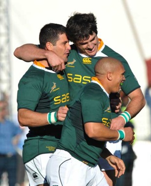 Morne Steyn of South Africa celebrates his first try with Ricky Januarie and Jaque Fourie, South Africa v Italy, Buffalo City Stadium, East London, South Africa, June 26, 2010