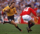 Australia centre Dominic Maguire stretches the Lions' defence