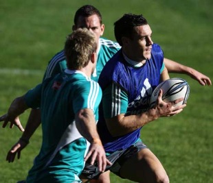All Blacks fly-half Dan Carter makes a break during training at North Harbour Stadium, Auckland, New Zealand, July 2, 2010
