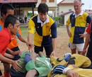 France fly-half Francois Trinh-Duc oversees a scrum during a visit to Cambodia
