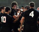 All Blacks prop Tony Woodcock is mobbed after scoring