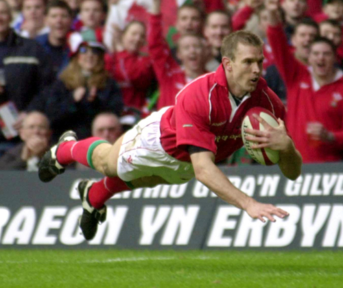 Wales' Dafydd James dives in to score a try