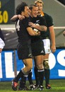 New Zealand's Doug Howlett and Carlos Spencer celebrate a try