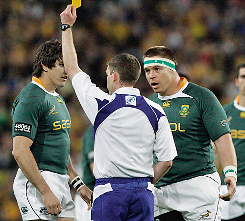 South Africa's Jaque Fourie receives a yellow card from referee George Clancy