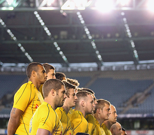 The Wallabies pose for a squad photo under a closed roof at Etihad Stadium