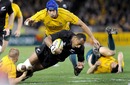 All Blacks winger Ma'a Nonu is taken down by Drew Mitchell
