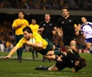 Wallaby fullback Adam-Ashley Cooper dives over