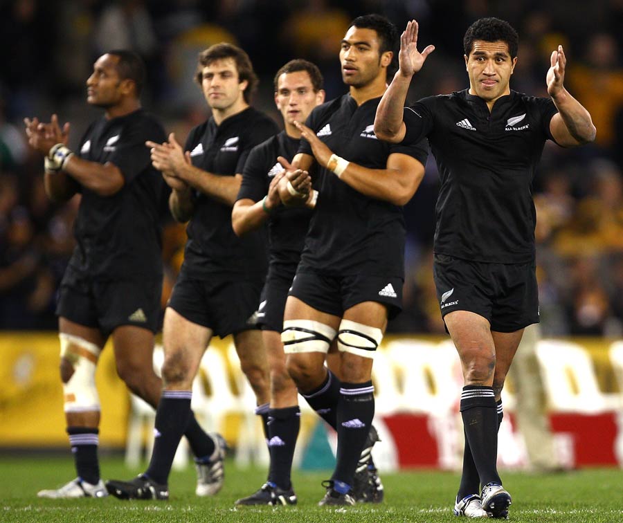 The victorious All Blacks salute their fans at the fulltime whistle