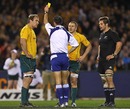 Referee Craig Joubert shows Australia's Drew Mitchell a second yellow card