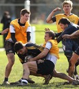 Wallabies centre Anthony Faingaa is hauled to the ground during training