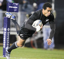 Mils Muliaina dives over to score for the All Blacks