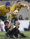 All Blacks captain Richie McCaw tackles Richard Brown of the Wallabies
