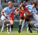 Toulon No.8 Juan Martin Fernandez Lobbe is hauled in by the Bayonne defence
