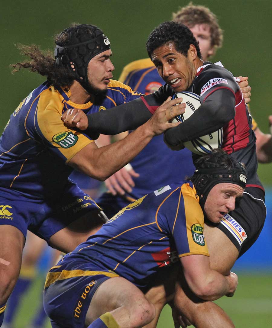 North Harbour's Ken Pisi is tackled by the Otago defence