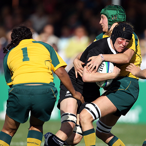 New Zealand's Victoria Heighway is tackled by the Wallaroos