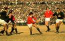 Andy Irvine of the Lions attacks the Springbok line