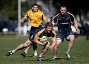 Wallabies flanker David Pocock carries the ball during training