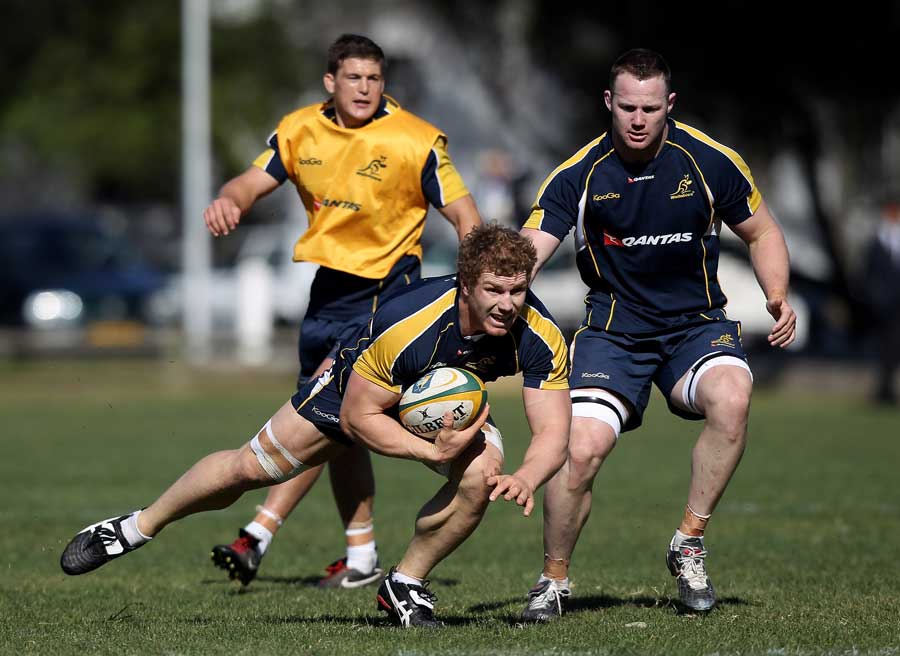 Wallabies flanker David Pocock carries the ball during training