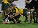 New Zealand's Tom Marshall is tackled by Australia's Paul Alo-Emile