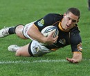 Wellington's Shaun Treeby slides in to score a try