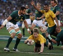 Pierre Spies can only watch as Kurtley Beale celebrates James O'Connor's first try and Australia's second
