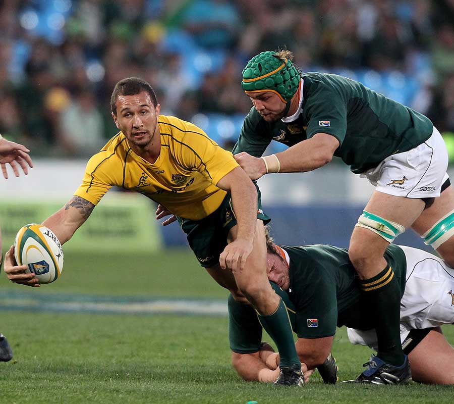 Quade Cooper lookes to offload out of the tackle against the Springboks