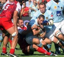 Perpignan's Kevin Boulogne works hard to protect the ball
